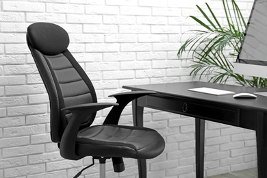 Stylish workplace interior with modern office chair