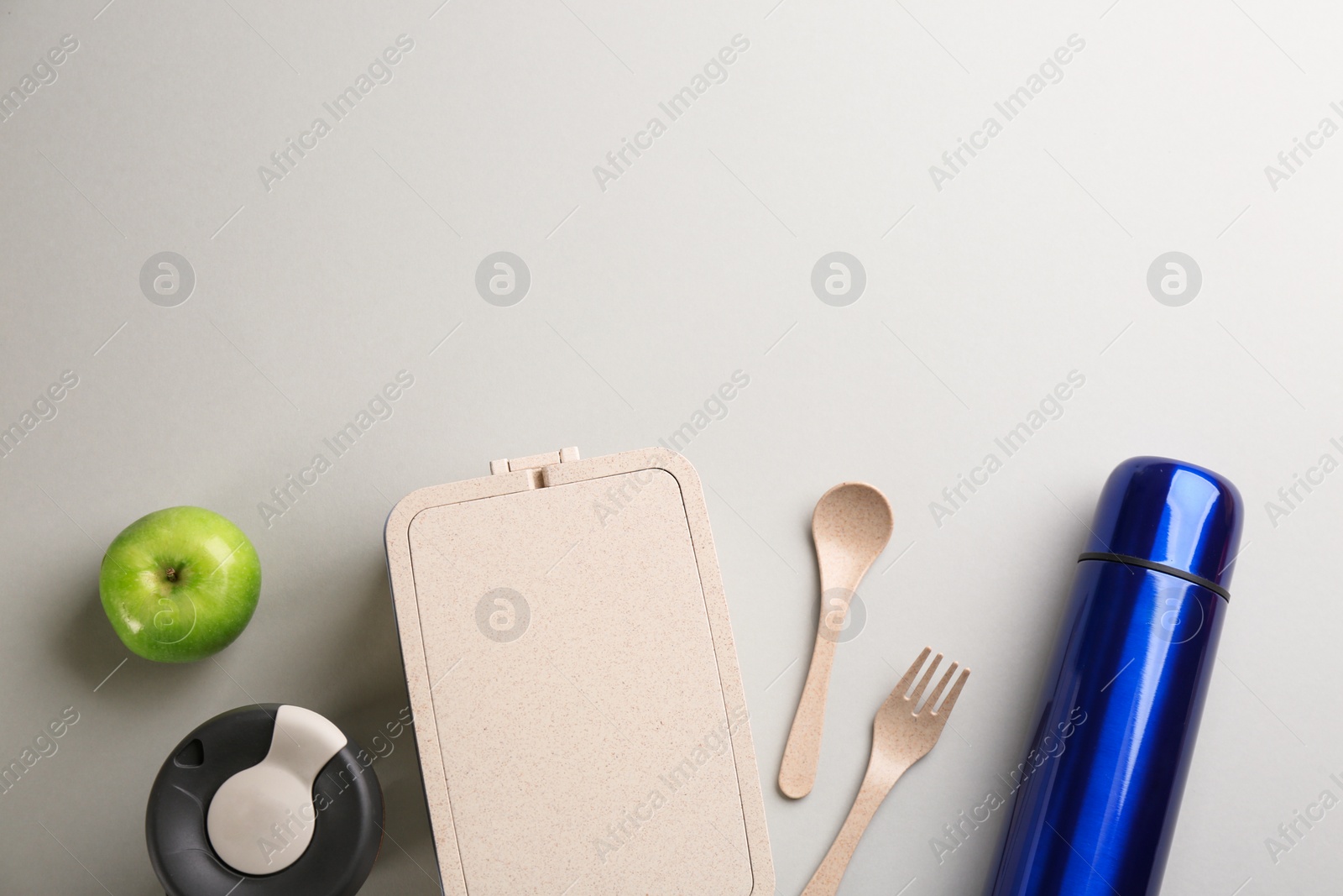 Photo of Flat lay composition with thermos on light grey background. Space for text
