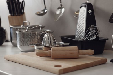 Set of different utensils on countertop in kitchen