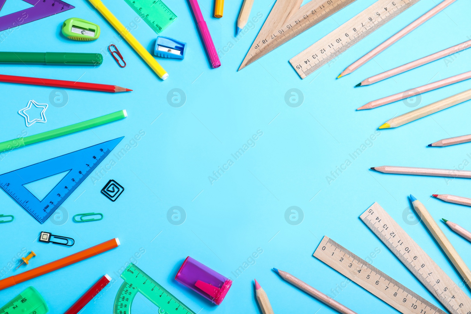 Photo of Flat lay composition with plastic and wooden stationery on light blue background, space for text. Recycling concept