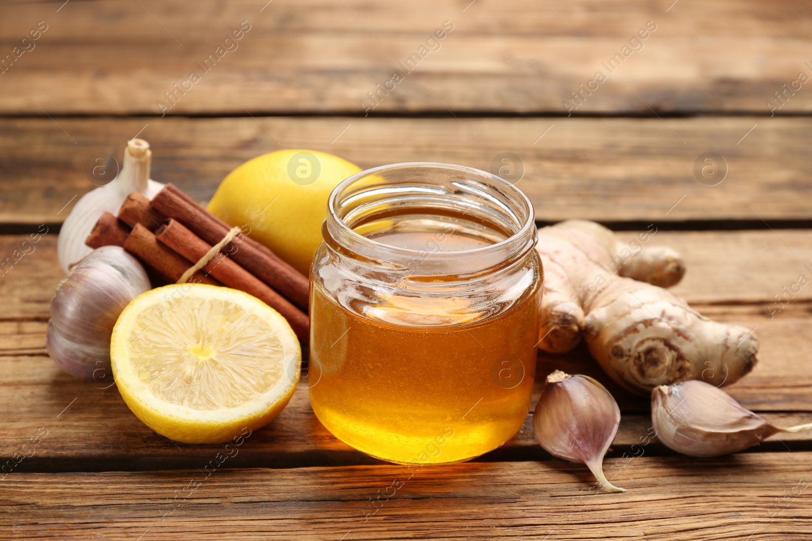 Photo of Different fresh products on wooden table. Natural antibiotics