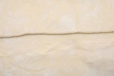 Photo of Raw puff pastry dough as background, top view