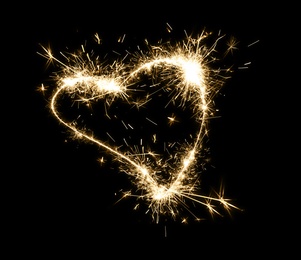 Bright sparkling heart contour on black background 