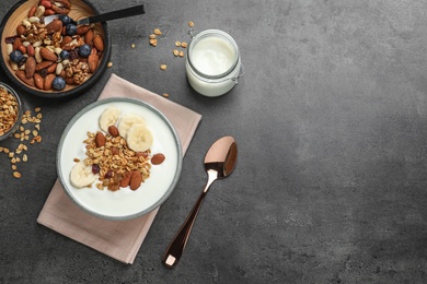 Photo of Tasty yogurt with banana and granola for breakfast on table, top view