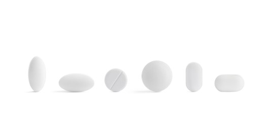 Image of Set of different pills in row isolated on white