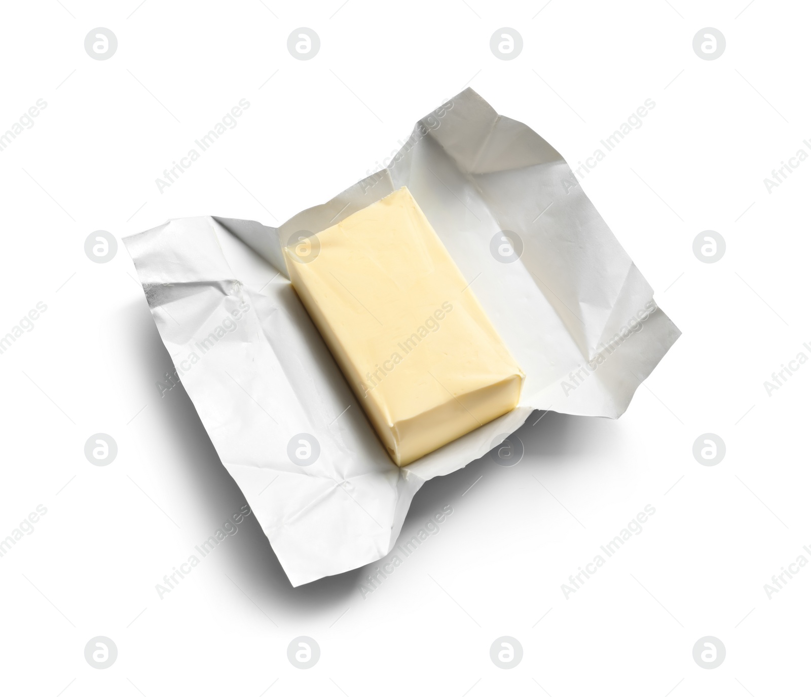 Photo of Unwrapped block of fresh butter on white background