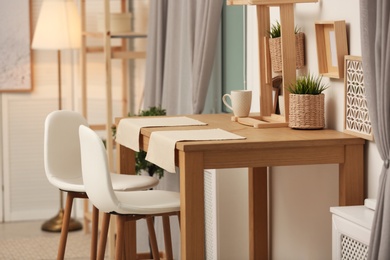 Modern room interior with wooden dining table