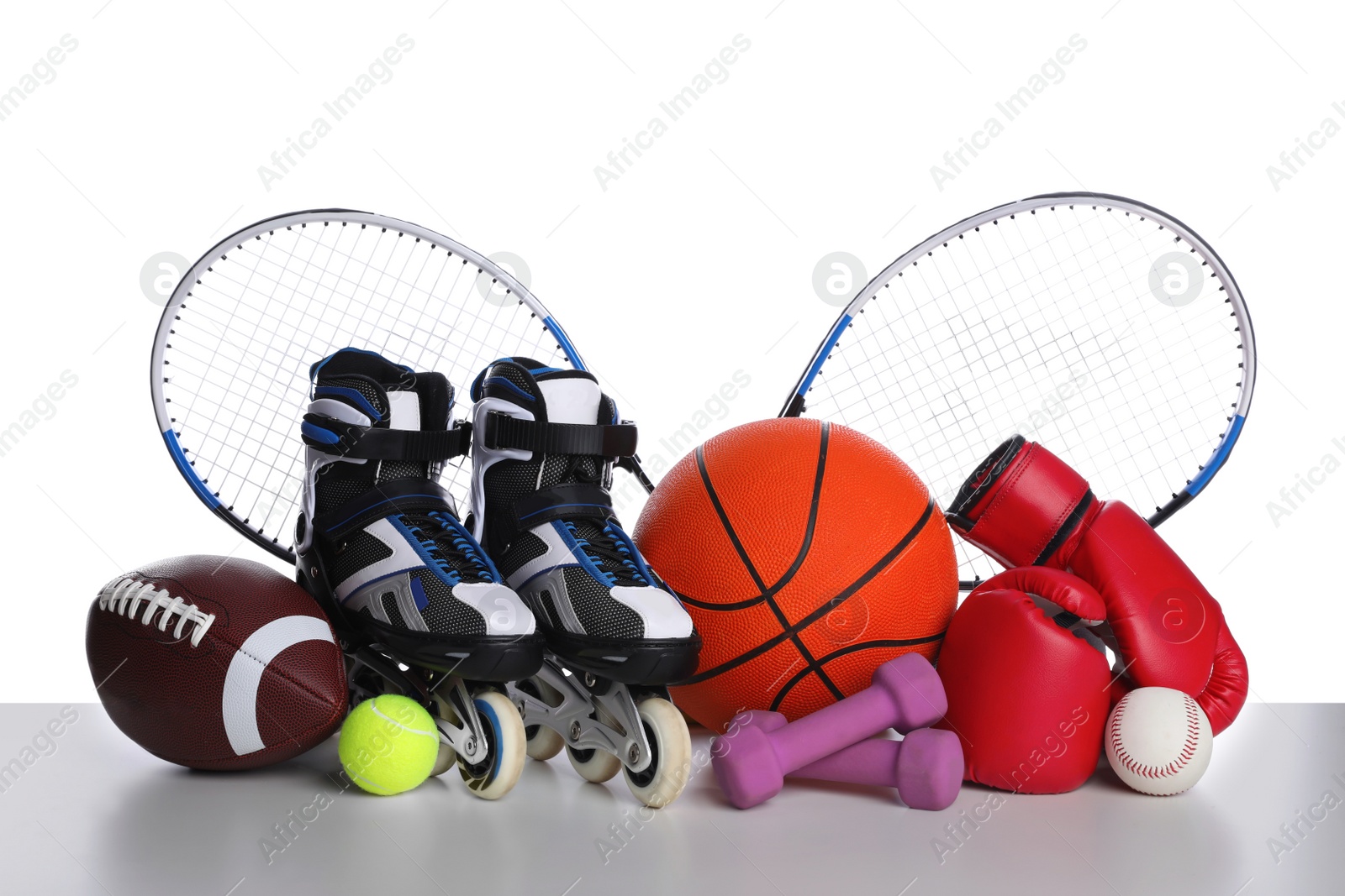 Photo of Set of different sports equipment on white background