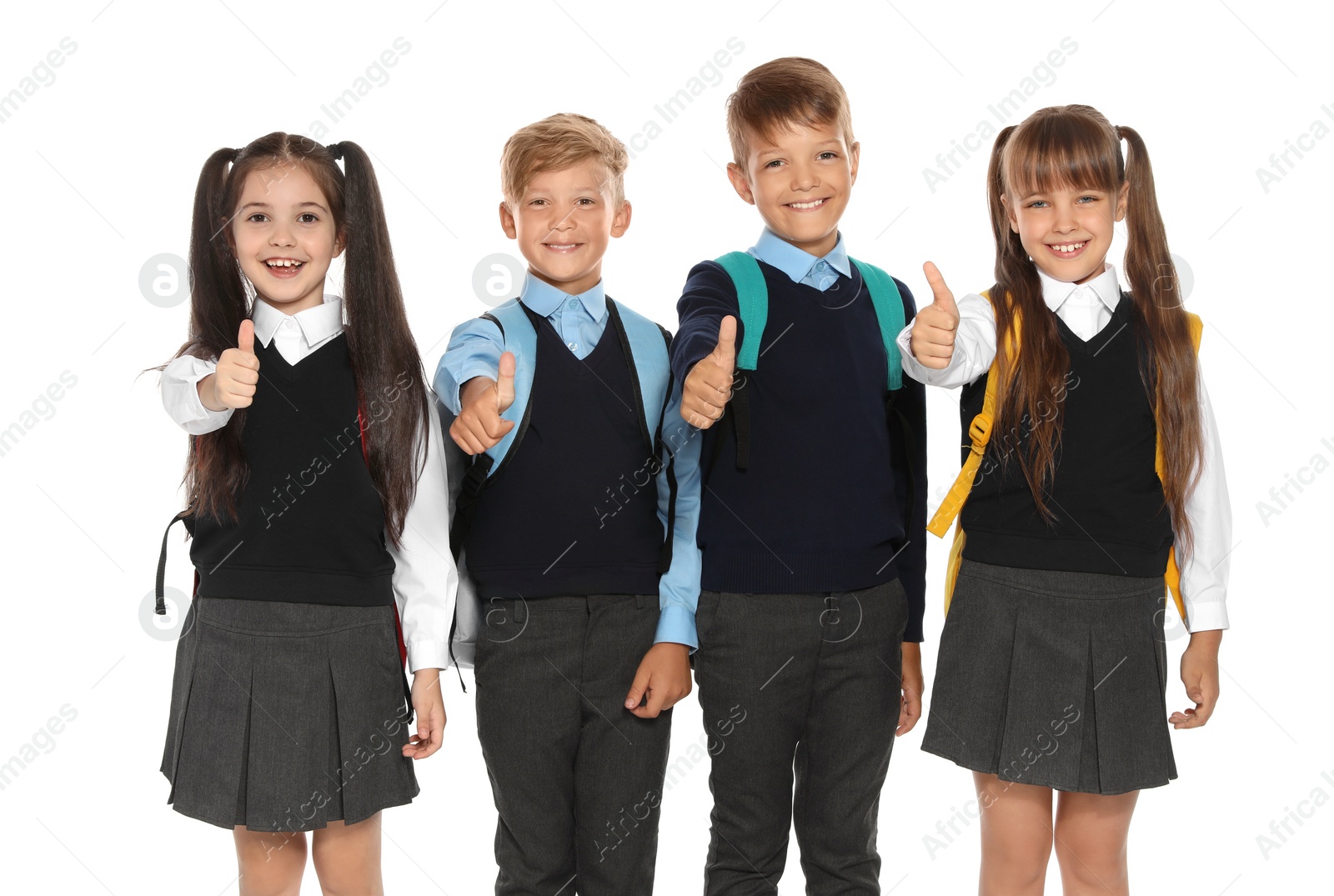 Photo of Little children in stylish school uniform on white background