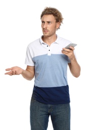 Young man with mobile phone on white background