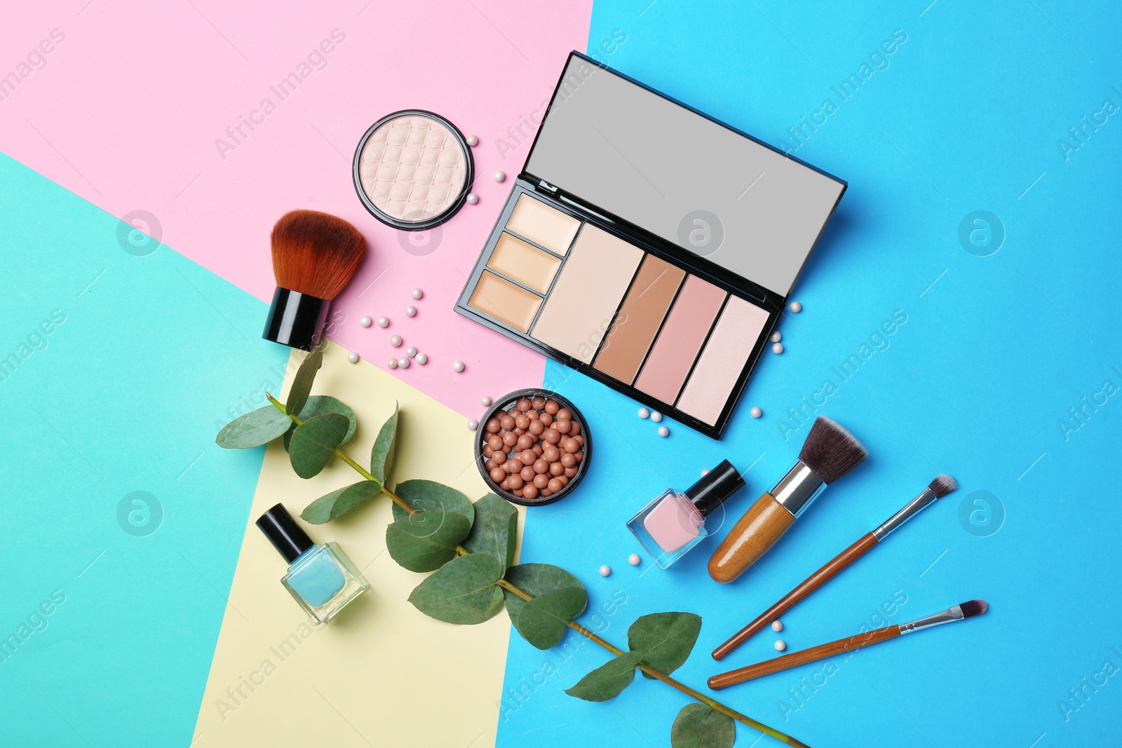 Photo of Decorative makeup products on color background