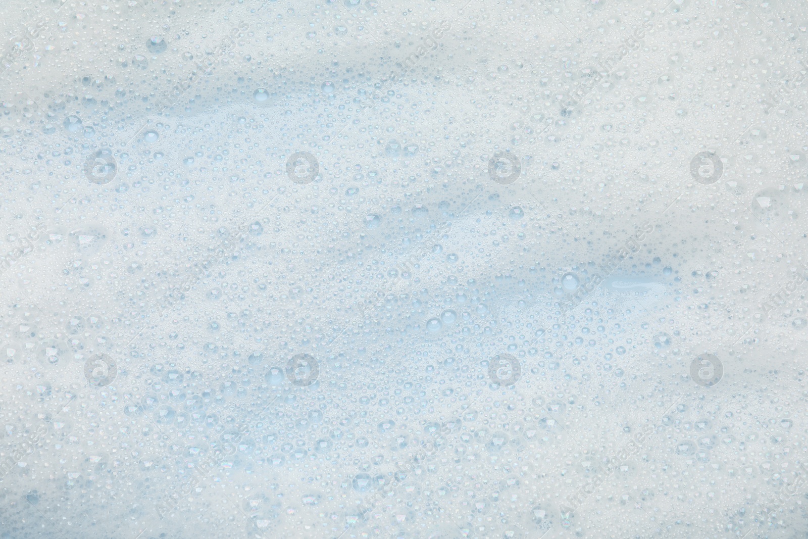 Photo of White washing foam as background, top view