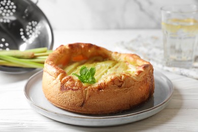 Photo of Freshly baked rhubarb pie on white wooden table