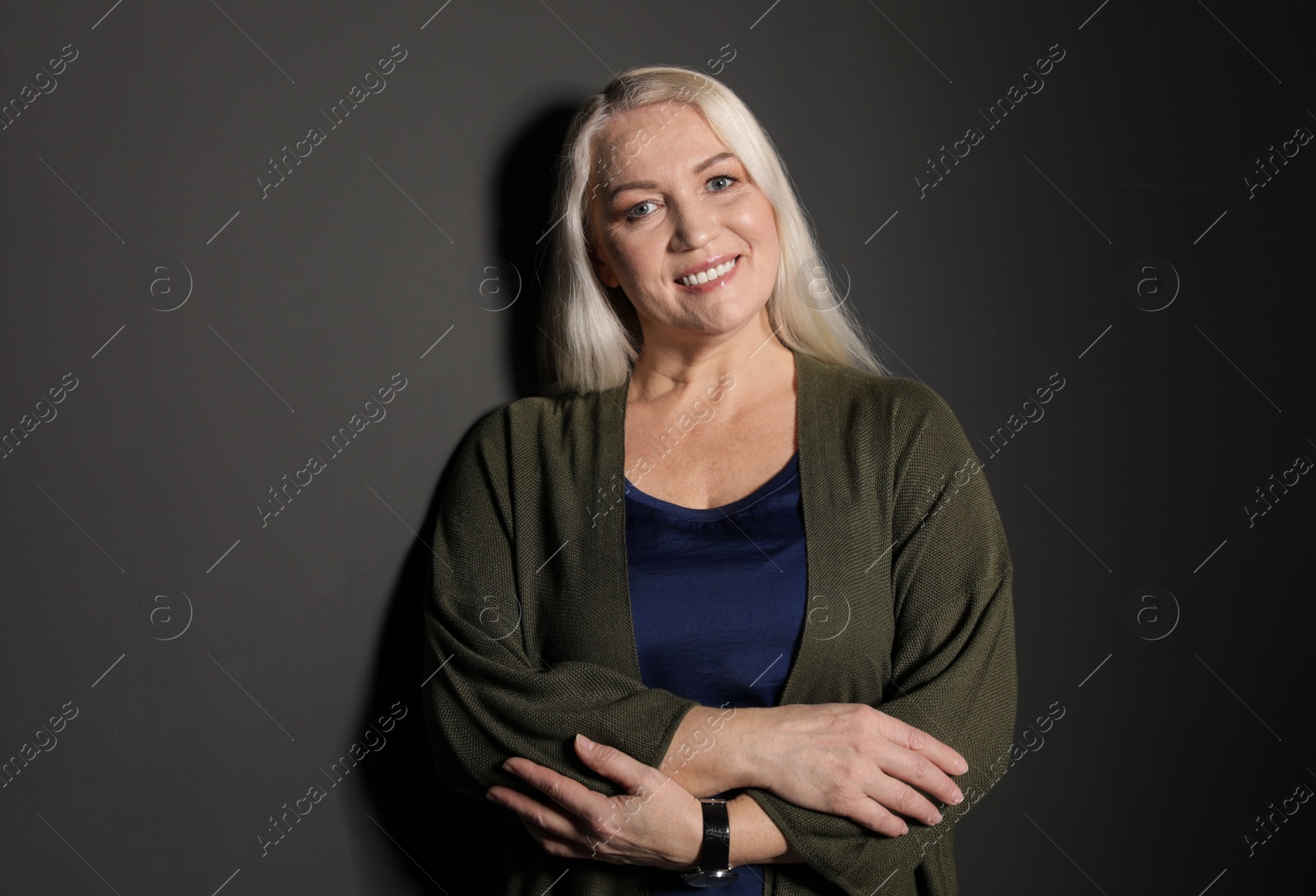 Photo of Portrait of mature woman on black background