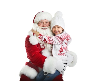 Photo of Little girl hugging authentic Santa Claus on white background