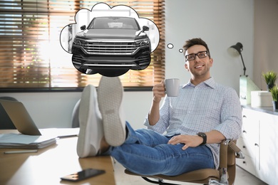 Man with cup of drink dreaming about new car at workplace
