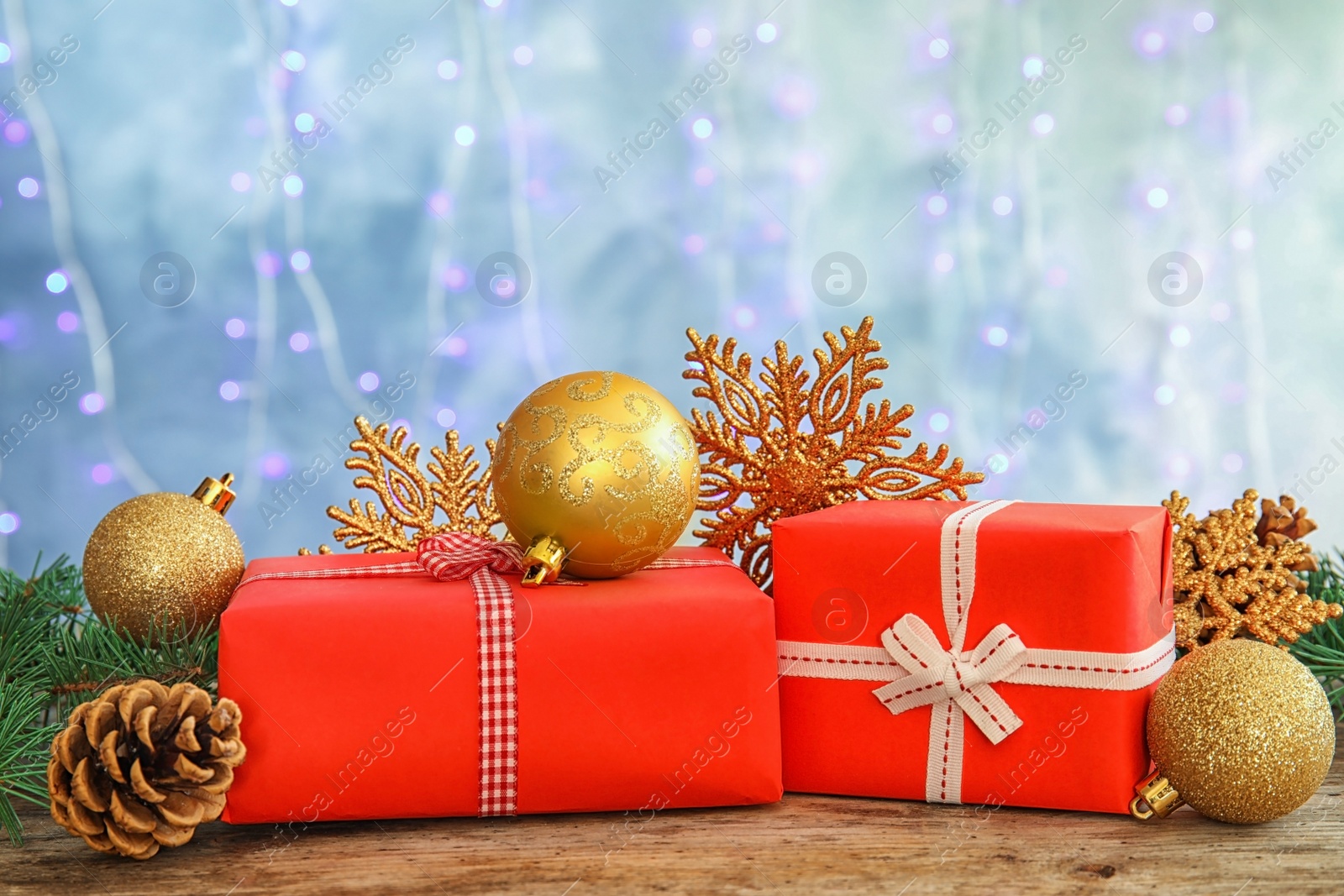 Photo of Beautiful Christmas composition with festive decor and gift boxes on table