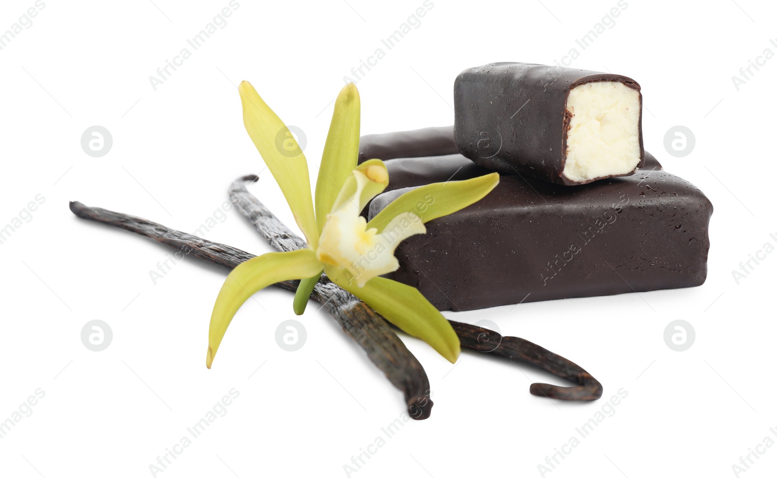 Photo of Glazed curd cheese bars, vanilla pods and flower isolated on white