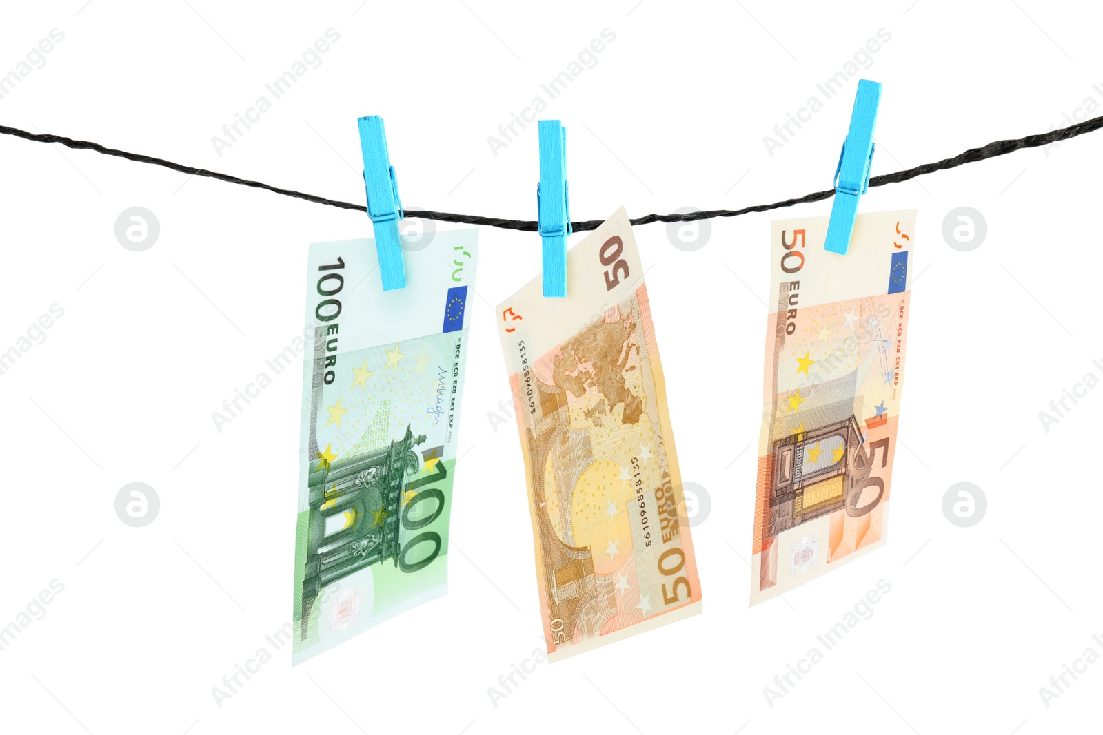 Image of Money laundering. Euro banknotes hanging on clothesline against white background