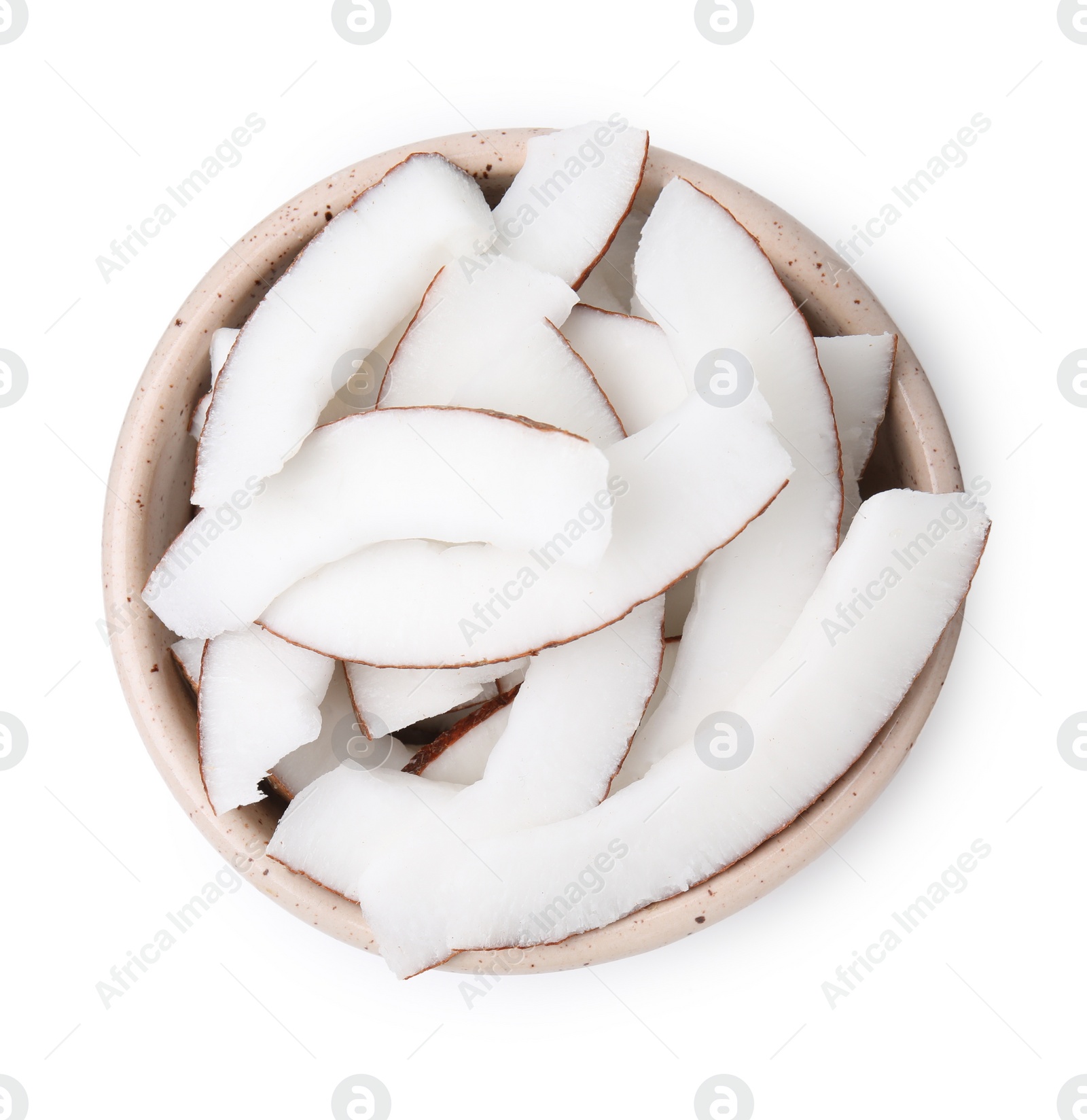 Photo of Coconut pieces in bowl isolated on white, top view