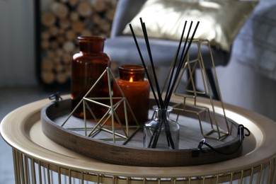 Wooden tray with decorations on table in room