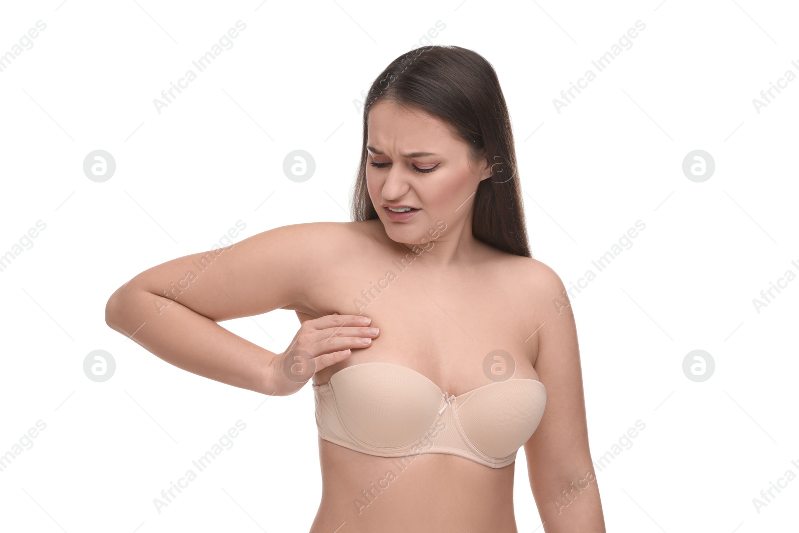 Photo of Mammology. Woman in bra doing breast self-examination on white background