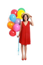 Young woman holding bunch of colorful balloons on white background