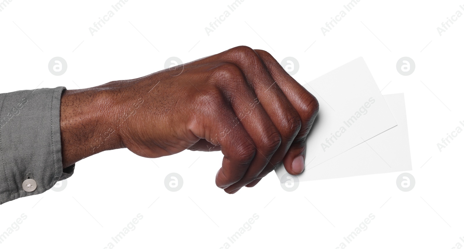 Photo of African American man holding paper cards on white background, closeup. Mockup for design