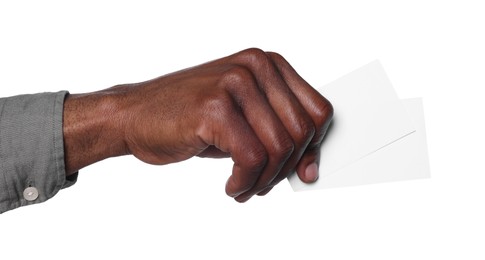Photo of African American man holding paper cards on white background, closeup. Mockup for design