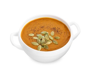 Photo of Delicious pumpkin cream soup with seeds in bowl isolated on white