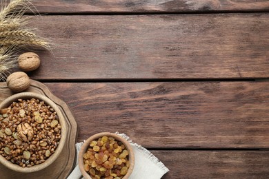 Photo of Traditional Christmas slavic dish kutia served on wooden table, flat lay. Space for text