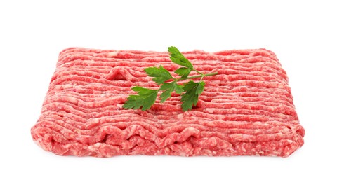 Photo of Raw ground meat and parsley isolated on white