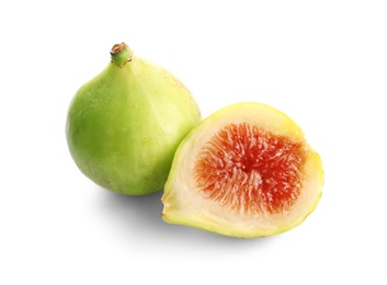 Photo of Whole and cut green figs on white background