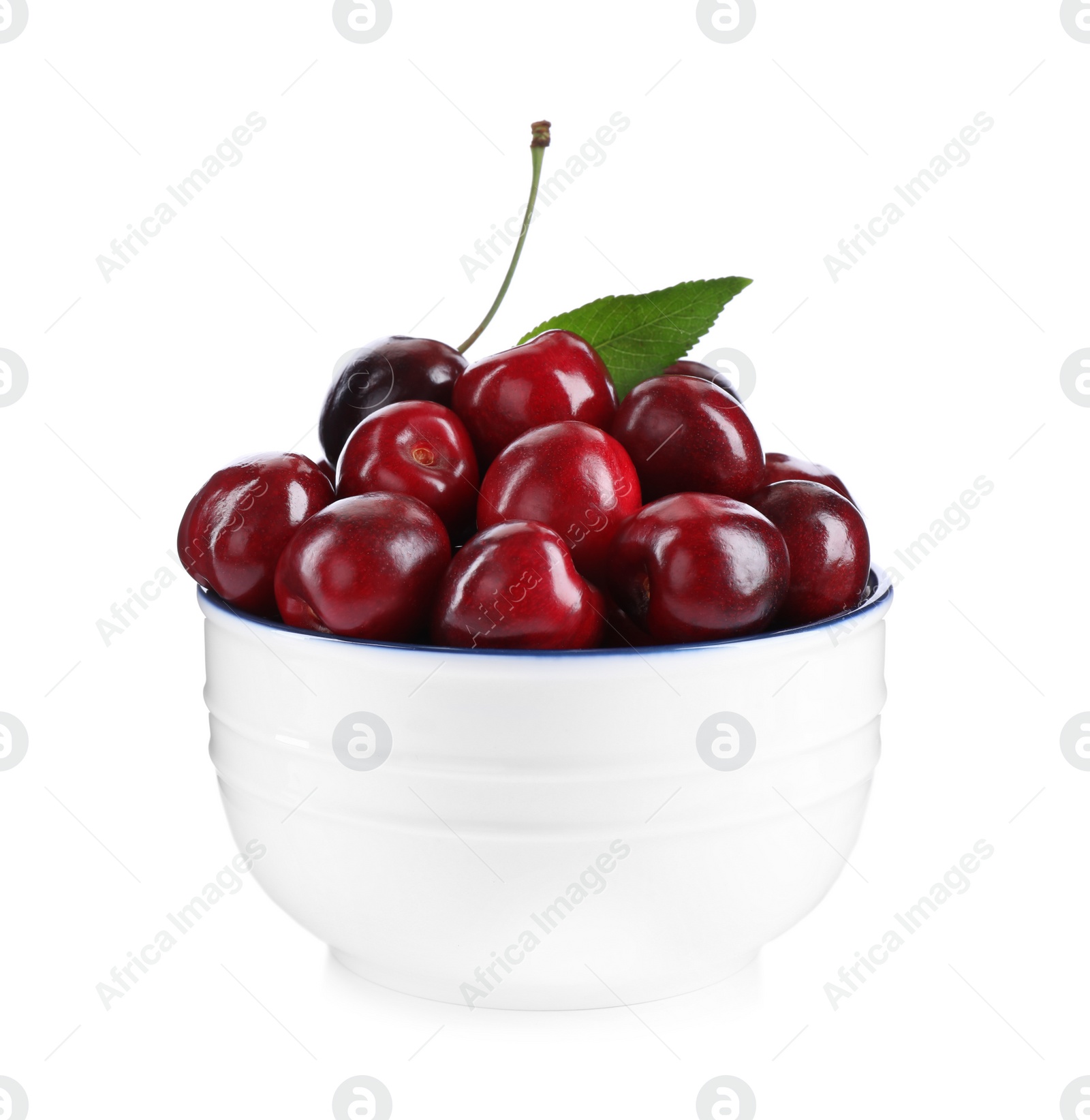 Photo of Tasty ripe red cherries in bowl isolated on white