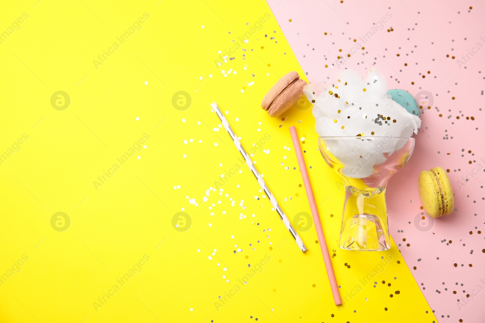 Photo of Flat lay composition with sweet cotton candy on color background, space for text