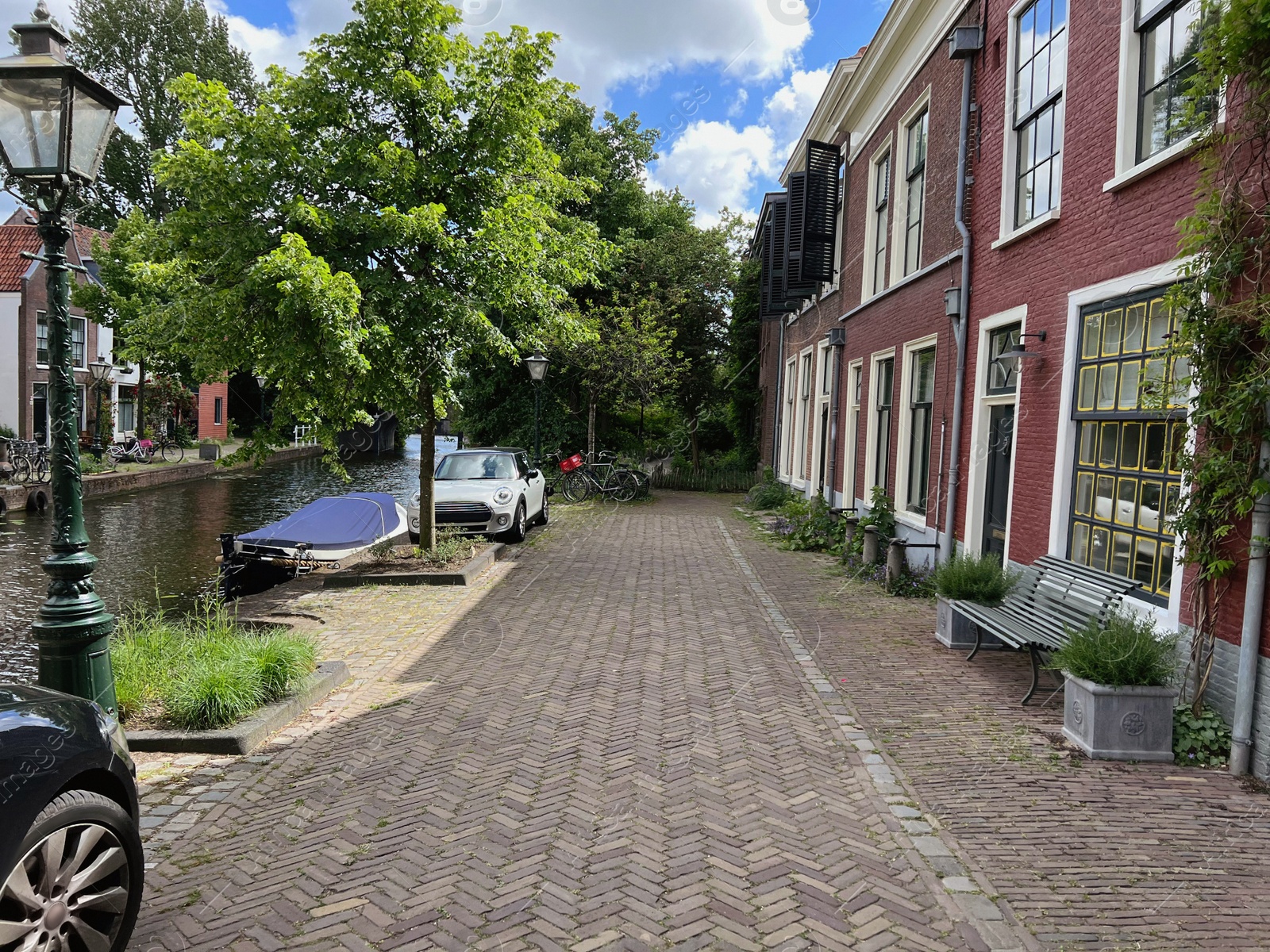 Photo of City street with beautiful buildings and canal