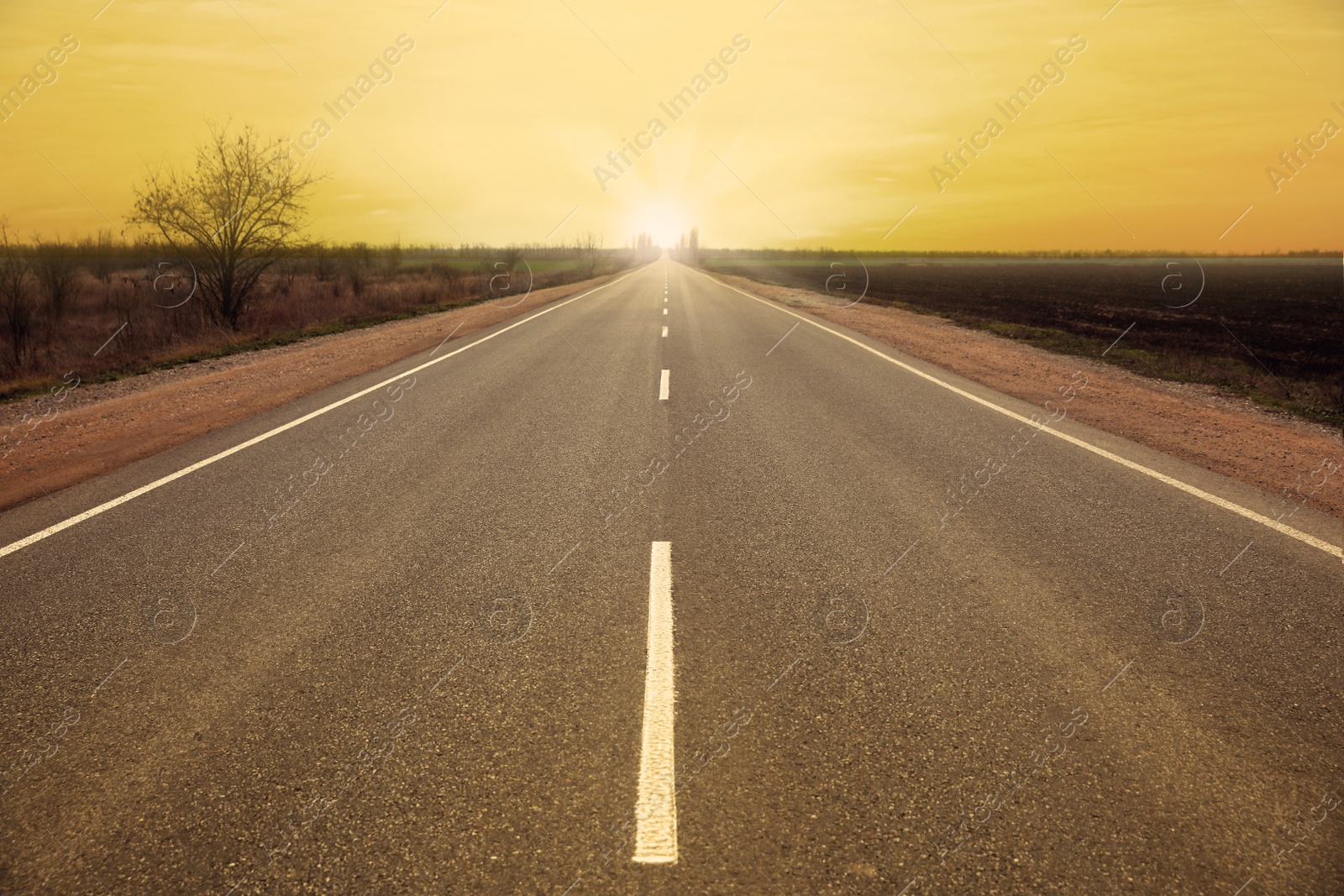 Image of Road trip. Beautiful view of asphalt highway at sunset 