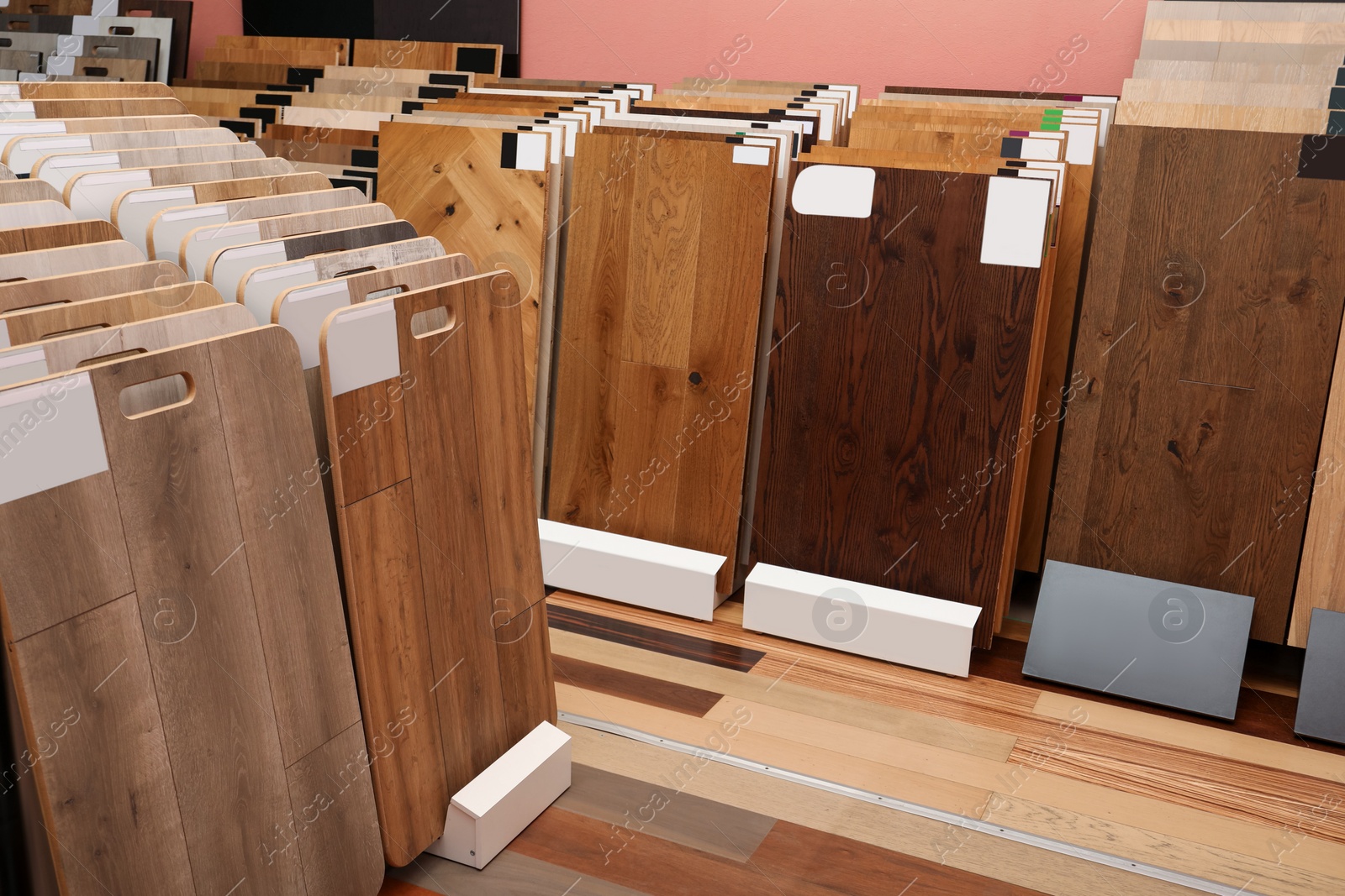 Photo of Many different samples of wooden flooring in store