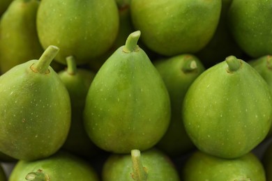 Photo of Many fresh green figs as background, closeup