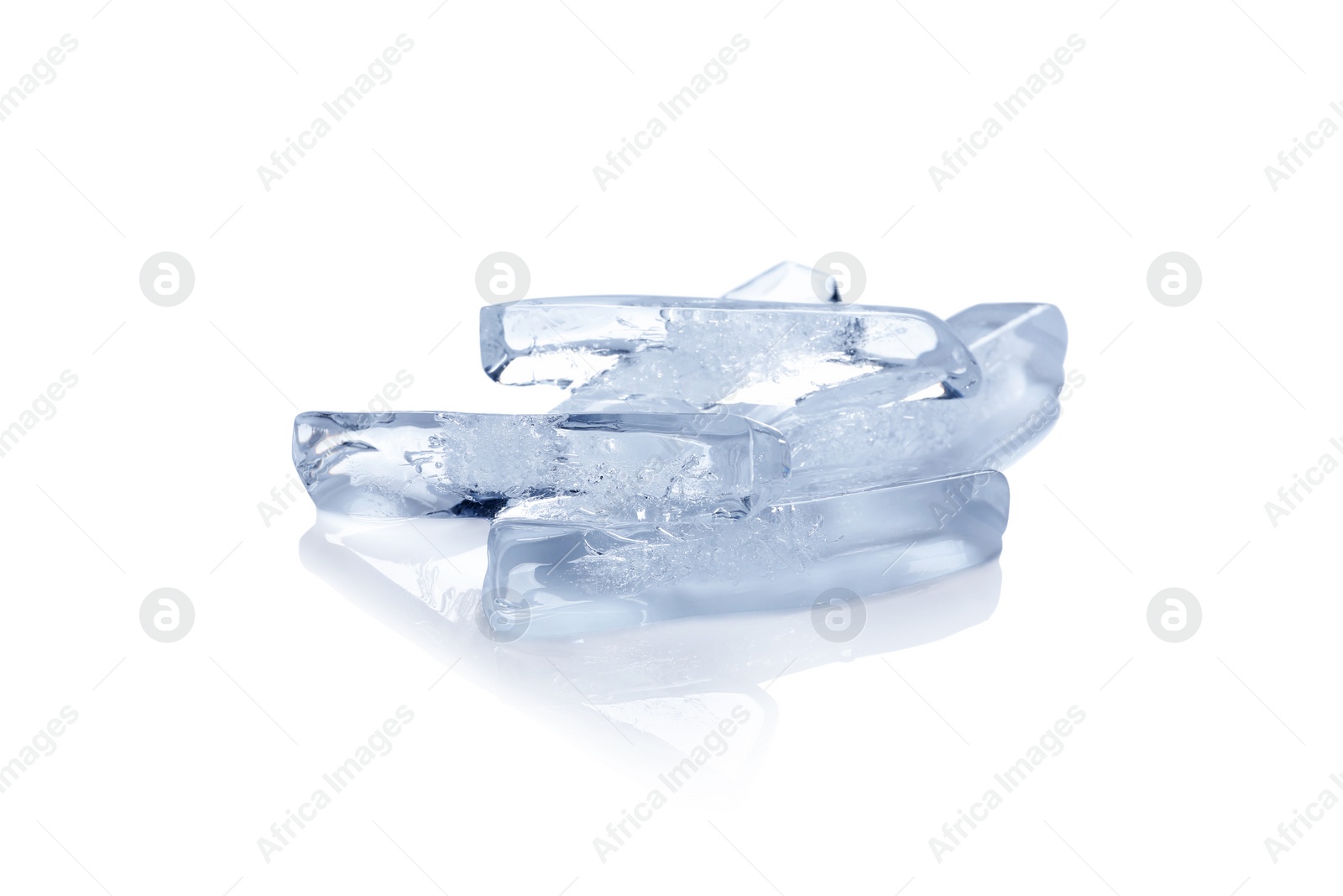 Photo of Pieces of ice melting on white background