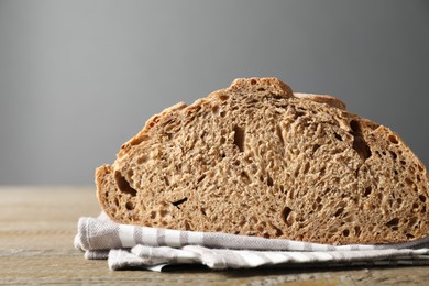 Photo of Freshly baked sourdough bread on wooden table