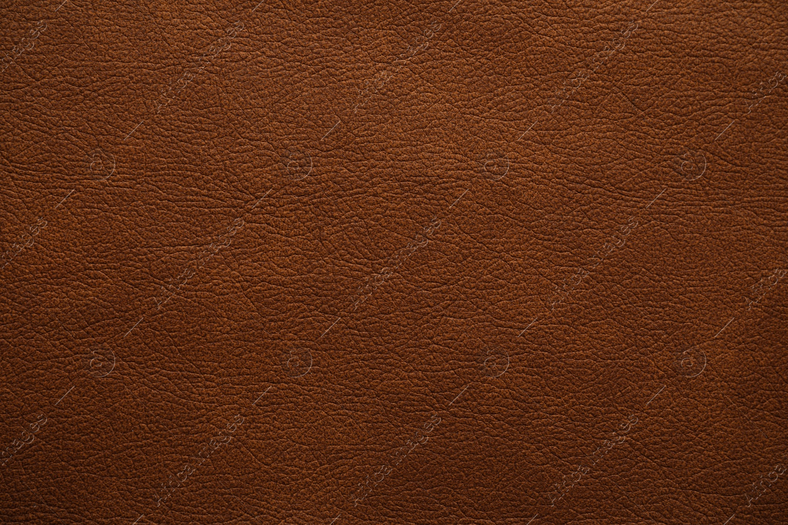 Photo of Texture of brown leather as background, closeup