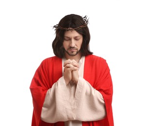 Photo of Jesus Christ with crown of thorns praying on white background