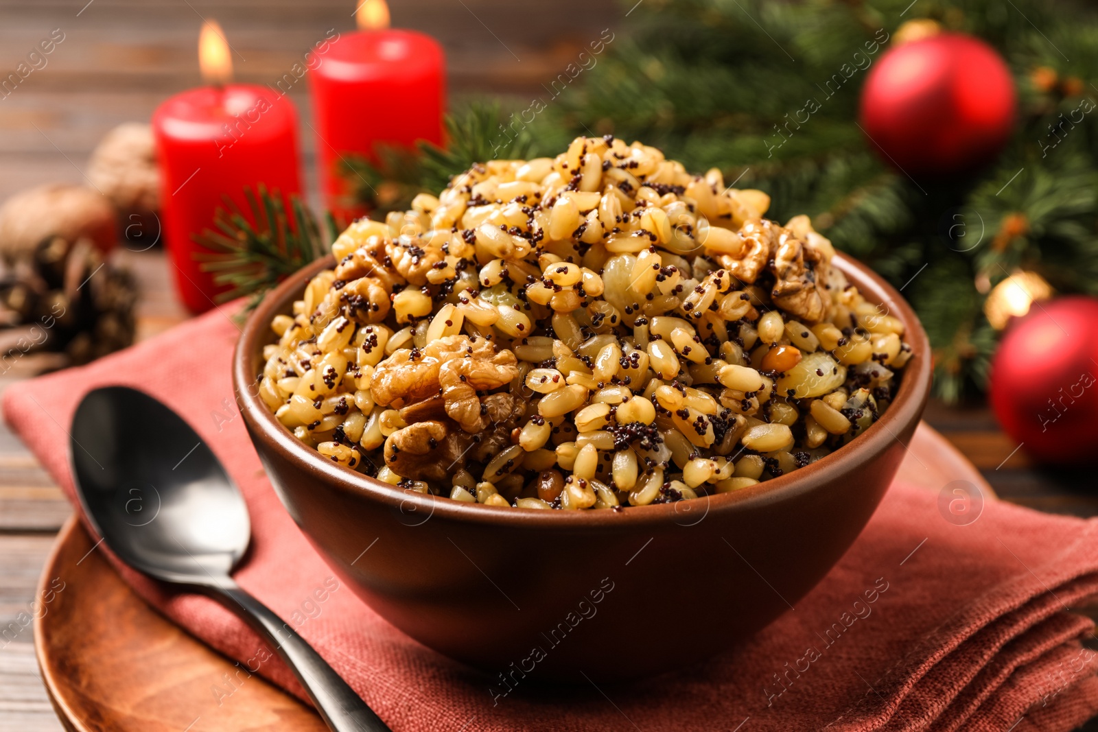 Photo of Traditional Christmas slavic dish kutia in bowl on table, closeup