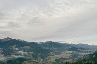 Aerial view of beautiful mountain village on cloudy day