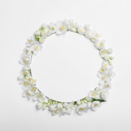 Photo of Frame of beautiful jasmine flowers on white background, flat lay. Space for text