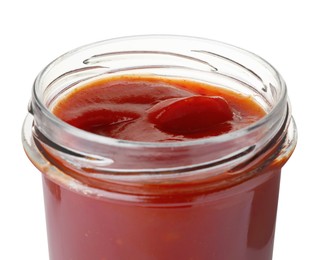 Photo of Glass jar of delicious ketchup isolated on white, closeup