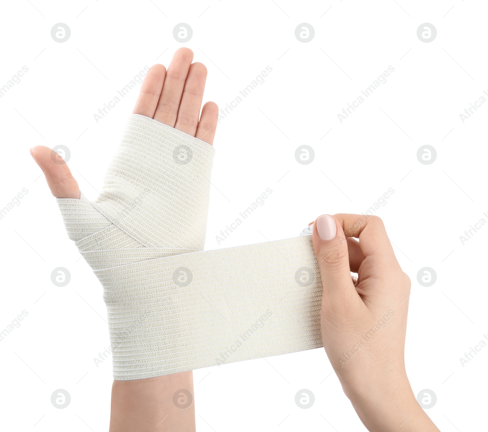 Photo of Woman applying medical bandage onto hand on white background, closeup