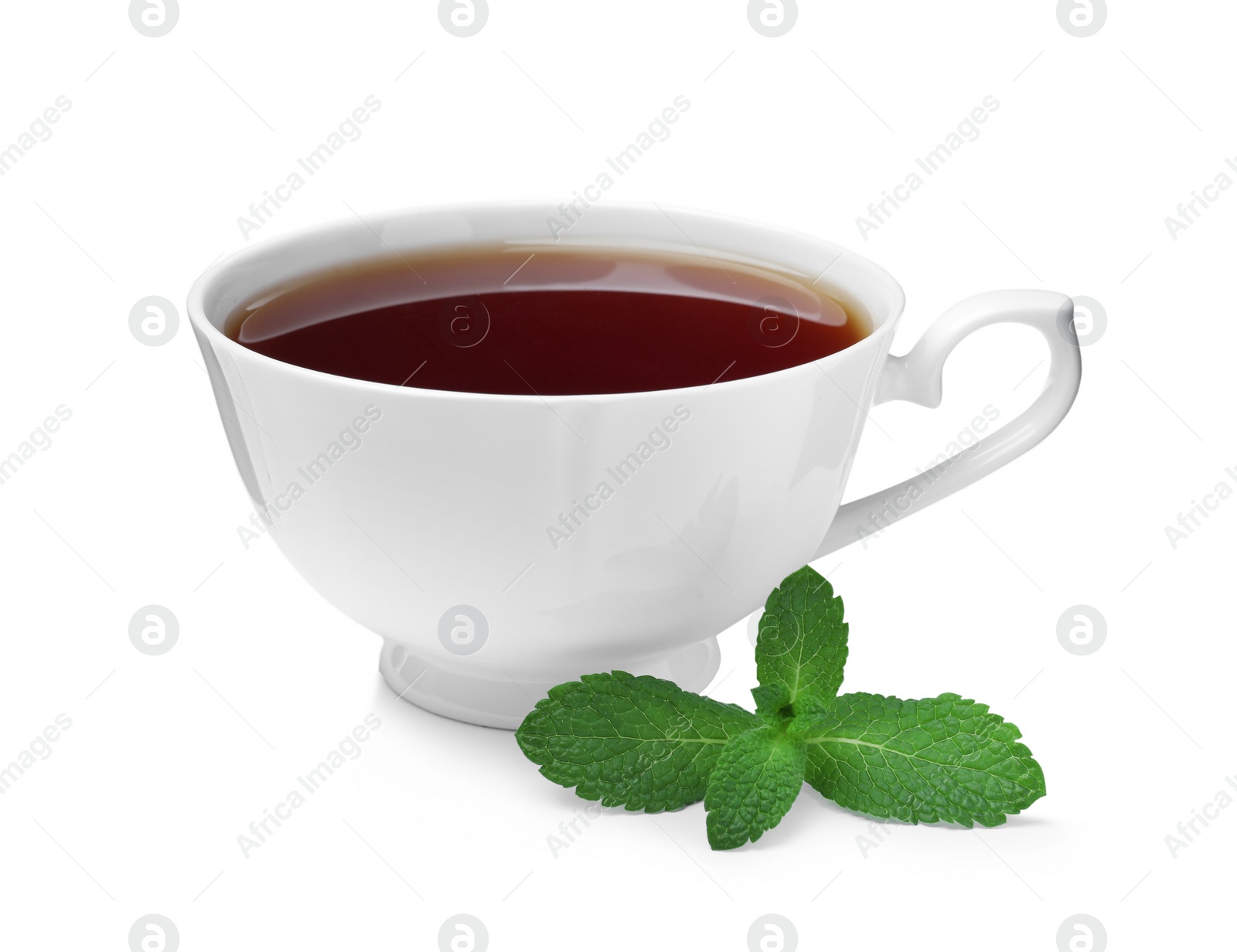 Photo of Cup of aromatic black tea with fresh mint on white background