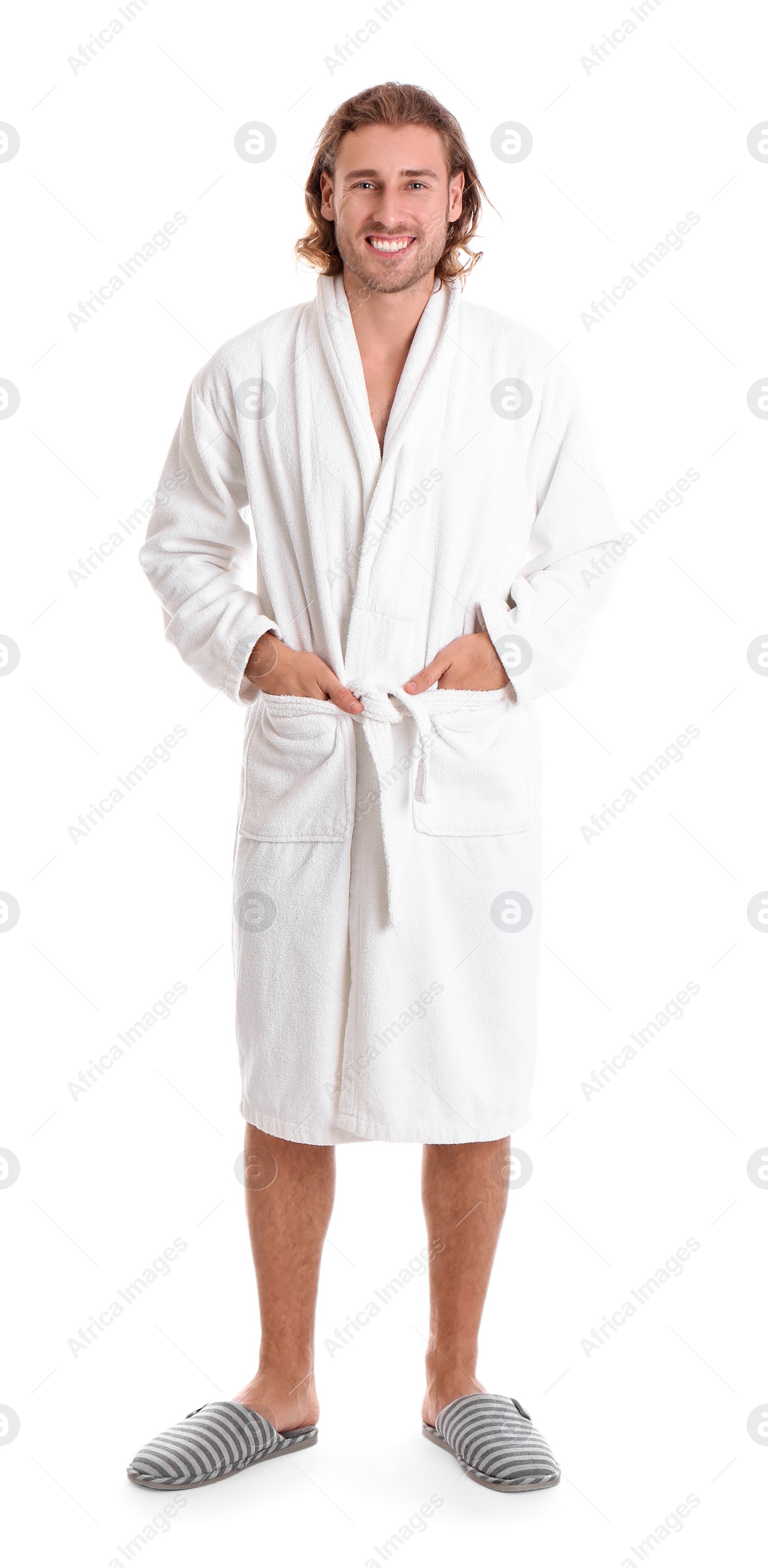 Photo of Young man in bathrobe on white background